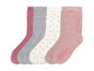 Ein Set mit vier Paar Socken in verschiedenen Farben und Mustern, darunter Punkte.