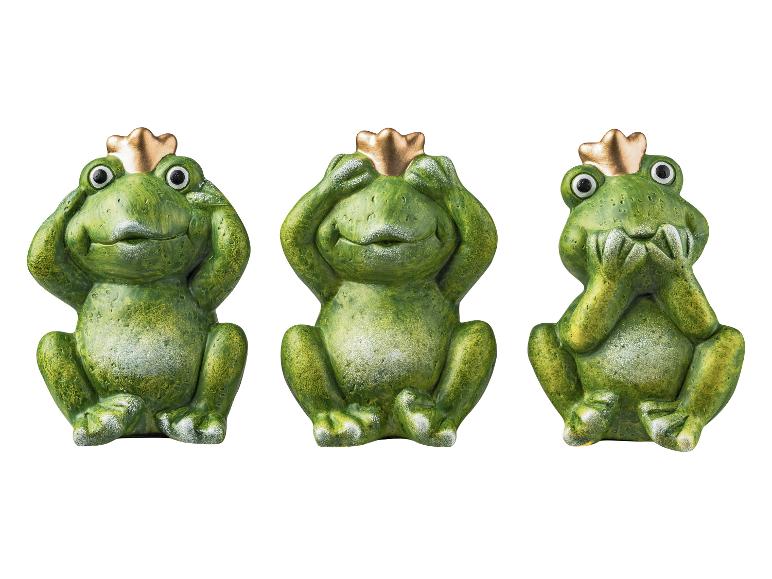 Drei grüne Frösche mit goldenen Kronen, die die 'Sehe kein Übel, höre kein Übel, sprich kein Übel'-Pose einnehmen.