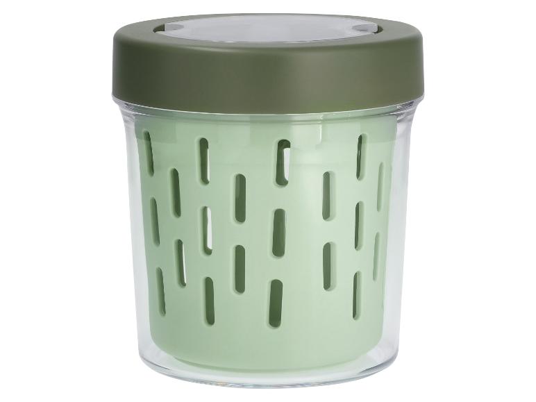 Grüner Lebensmittelbehälter mit transparentem Außengehäuse und dunkelgrünem Deckel