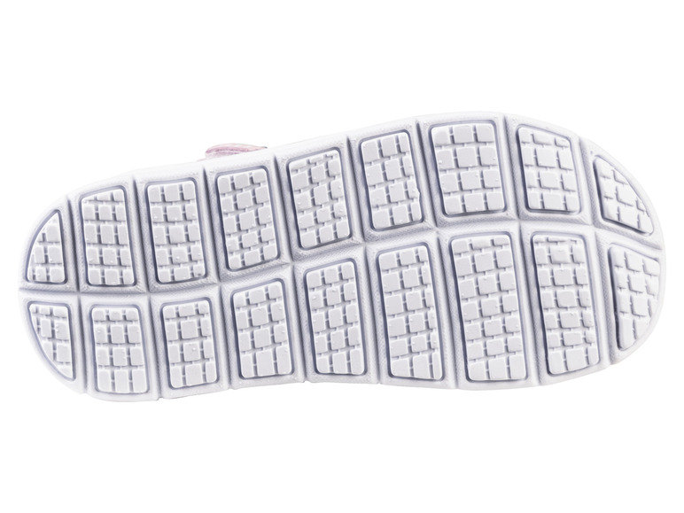 Weiße Gummisohle mit einem gerippten Muster.