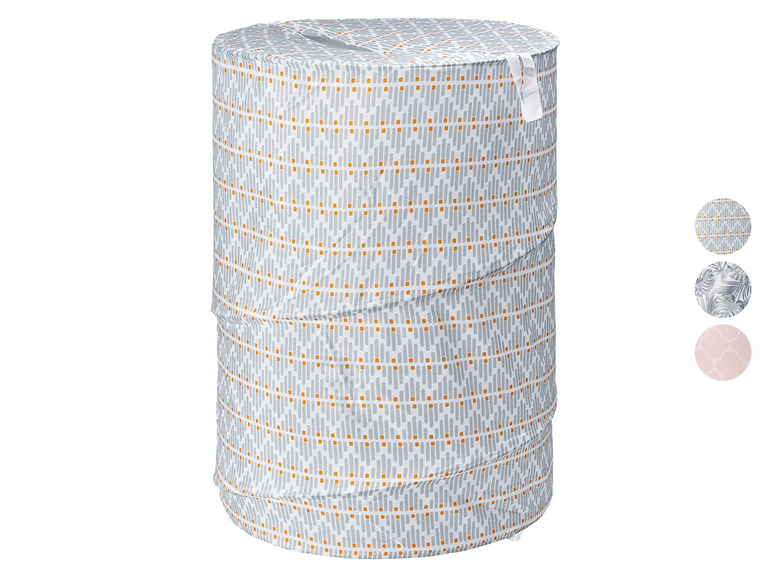 Runder Wäschekorb mit einem grau-orangen geometrischen Muster.