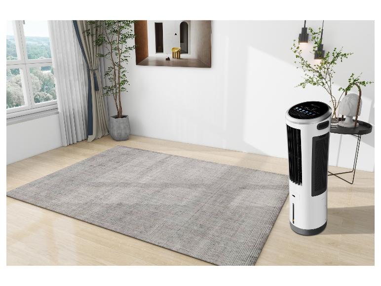 Ein weißer und schwarzer Luftreiniger in einem modernen Raum mit Teppich und Fenster.