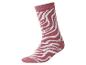 Eine rosa Socke mit weißem Zebramuster.
