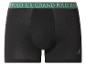 Schwarze Boxershorts mit grünem Bund, auf dem „GRAND POLO U.S.“ steht