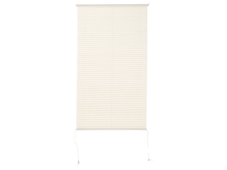 Ein cremefarbener Plissee-Vorhang