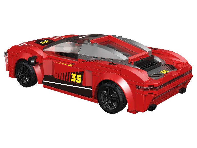 Rotes Spielzeug-Rennauto mit der Nummer 35 und transparentem Dach.