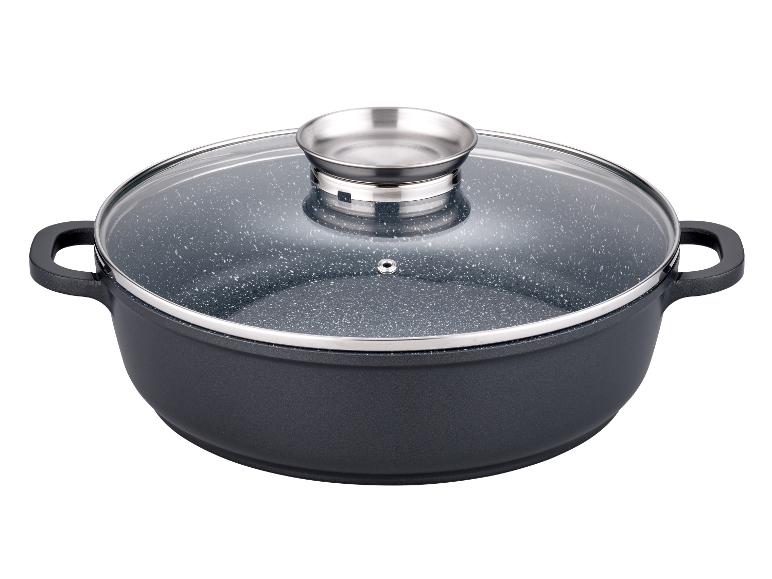 Ein schwarzer Topf mit einem Glasdeckel