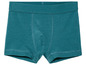 Ein Paar tealfarbene Boxershorts.