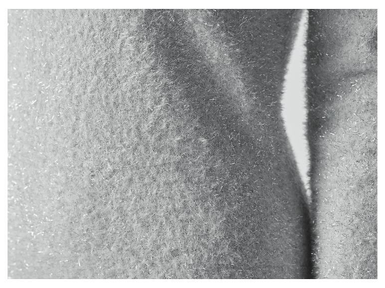 Nahaufnahme eines silbernen Glitzerstoffs