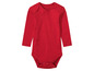 Ein roter Baby-Body mit langen Ärmeln.
