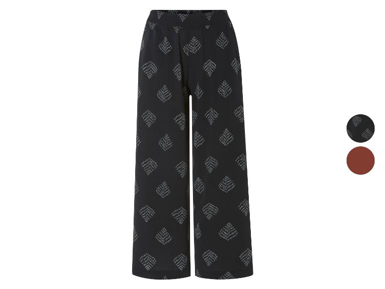 Weite Hose mit Blattmuster, in Schwarz und Braun.