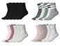 Vier Sets Socken: einfarbig schwarz, gestreift, mit Herzen und gepunktet.