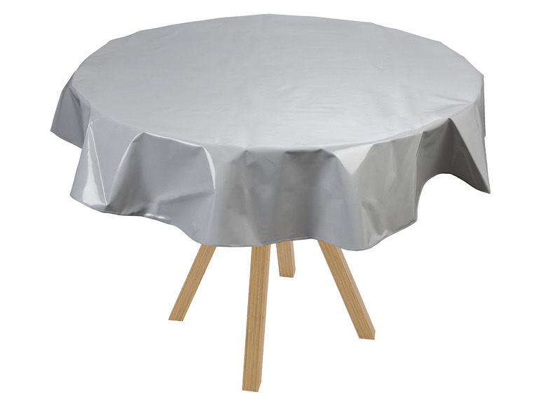 Eine graue Tischdecke auf einem runden Holztisch.