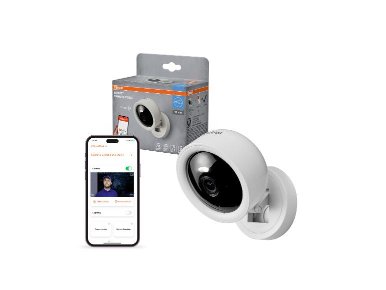 Smarte Kamera und ihre Verpackung mit einer Telefon-App-Oberfläche.
