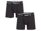 Zwei Paar schwarze Reebok Boxershorts mit weißen Logos an den Bund.