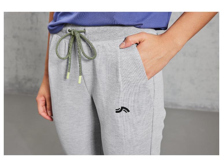 Graue Jogginghose mit grün-schwarzem Kordelzug und Logo