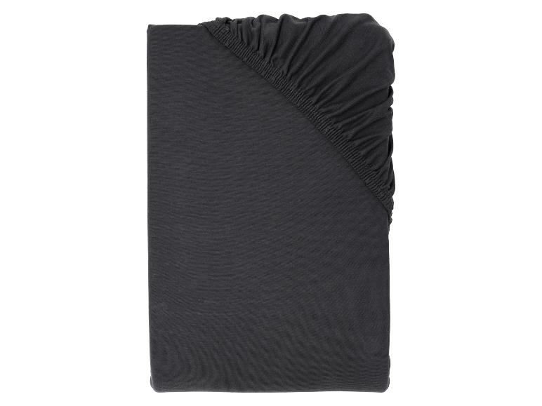 Dunkelgraues Baumwoll-Jersey-Spannbettlaken, gefaltet mit elastischen Details.