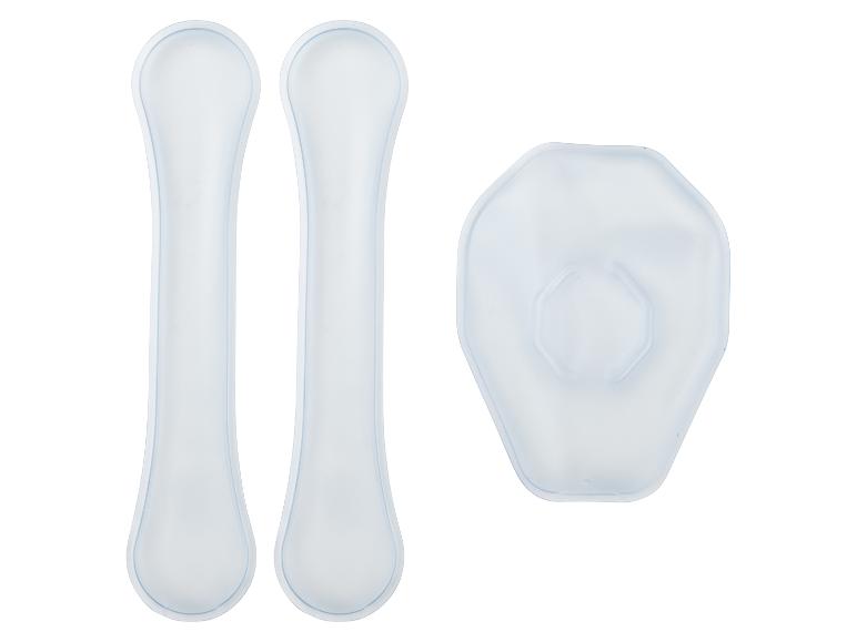 Zwei lange, schmale Silikonpads und ein sechseckiges Silikonpad, alle durchscheinend weiß.