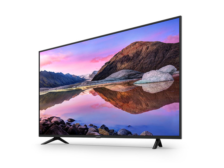 Ein schwarzer Flachbildfernseher mit einem Landschaftsbild eines Bergsees.