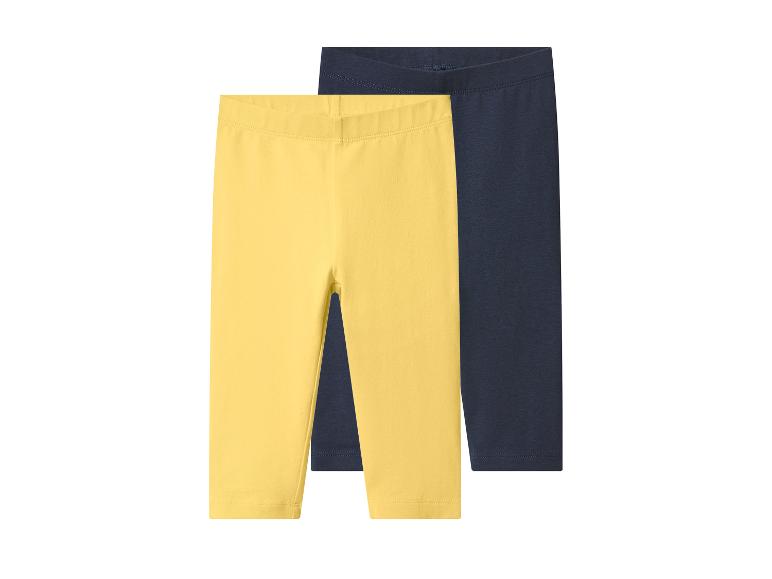Zwei Kinderleggings, eine gelbe und eine dunkelblaue.