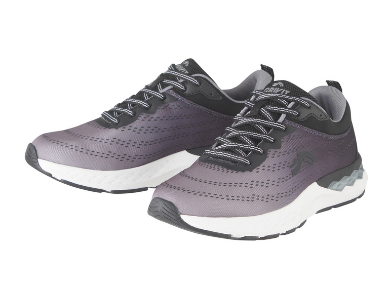 Ein Paar schwarze und graue Crivit Laufschuhe mit weißer Sohle.