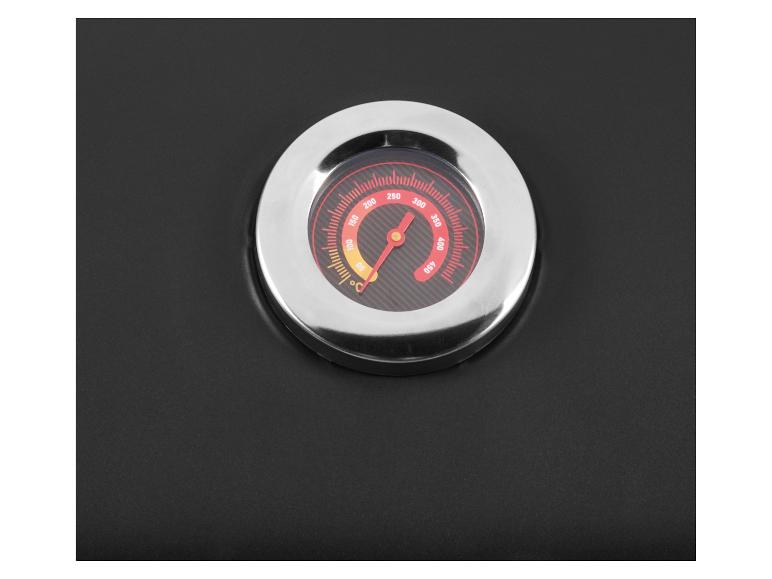 Integriertes Grillthermometer mit rotem Zeiger, der etwa 270°C auf schwarzem Hintergrund anzeigt.