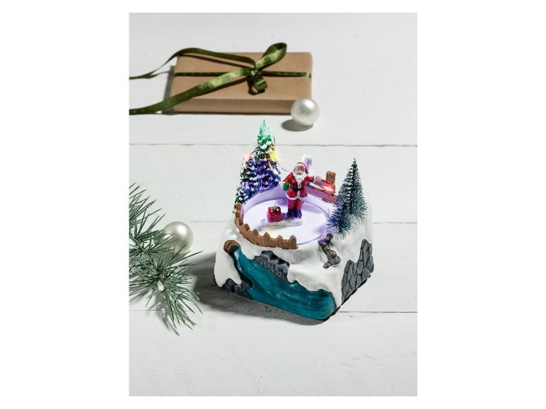 Eine Weihnachts-Musikbox mit Weihnachtsmann und Tannenbaum