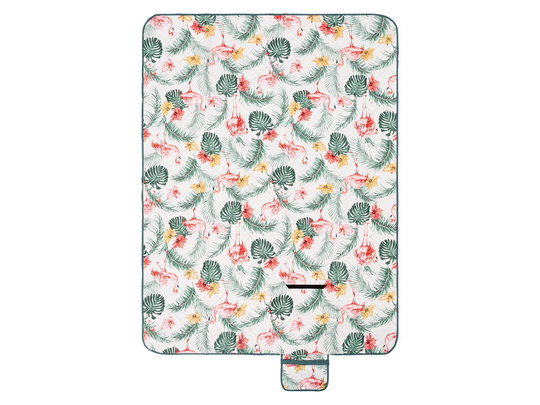 Eine Picknickdecke mit Flamingos und tropischen Blättern.