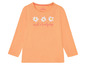 Ein orangefarbenes Langarmshirt mit Blumenmuster und dem Schriftzug 'such a lovely day' von Lupilu.