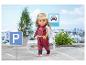 BABY born Puppe in rotem Overall und silberner Weste, mit Park- und Taxischildern.