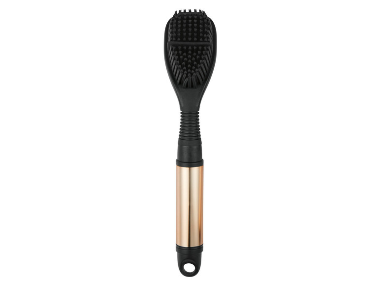 Eine schwarze Schrubbbürste mit goldenem Griff