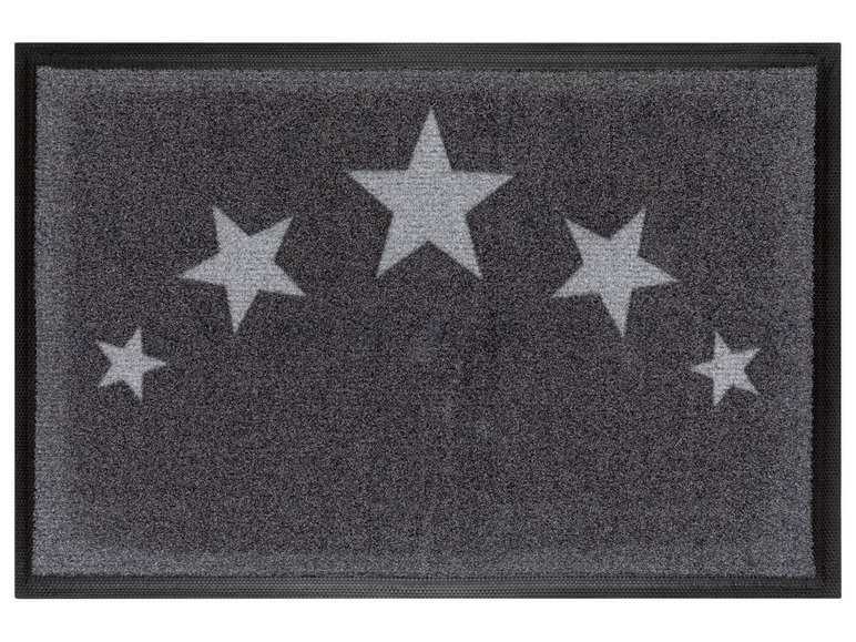 Eine graue Fußmatte mit Sternenmuster.