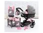 Ein rosa Kinderwagen mit Wanne, Tragetasche, Kommode und Zubehör mit Einhornmotiv.