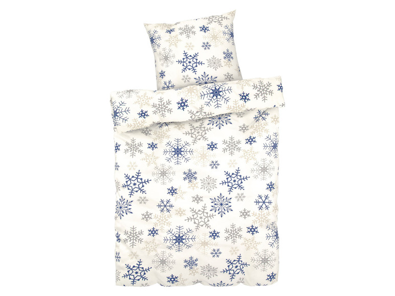 Ein weißer Bettbezug mit blauen und grauen Schneeflocken.