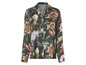Eine grüne Bluse mit langen Ärmeln und Blumenmuster.