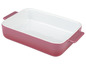 Eine rosa Auflaufform mit weißem Innenraum