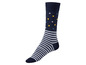 Eine dunkelblaue Socke mit weißen Streifen und gelben Punkten.