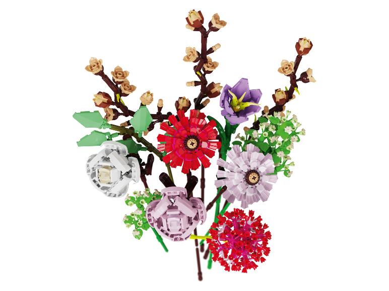 Bunter Strauß aus Bausteinblumen, darunter Rosen, Tulpen und andere Blüten.