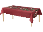 Rote Tischdecke mit festlichem Blumen- und Beerenmuster, über einem Holztisch drapiert.