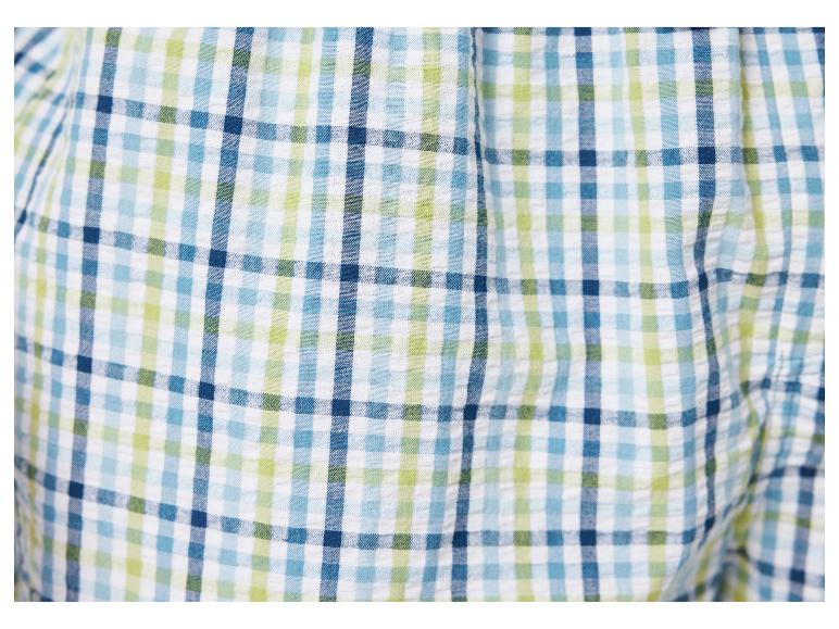 Blau, grün und weiß kariertes Gewebe.