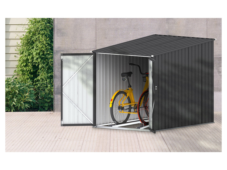 Ein schwarzer Metall-Schuppen mit einem gelben Fahrrad darin.