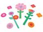 Bunte Papierblumen-Ausschnitte mit verschieden geformten Blütenblättern und Stielen.
