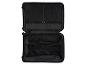 Offenes Inneres eines schwarzen Esmara Koffers mit Kompressionsriemen und Reißverschlusstaschen.
