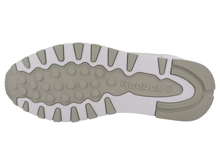 Schuhsohle mit grauem und weißem Muster und runden Noppen.