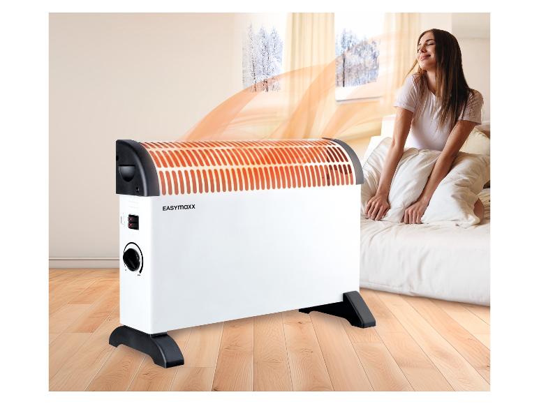 Heizgerät im Schlafzimmer mit einer Frau, die die Wärme genießt.