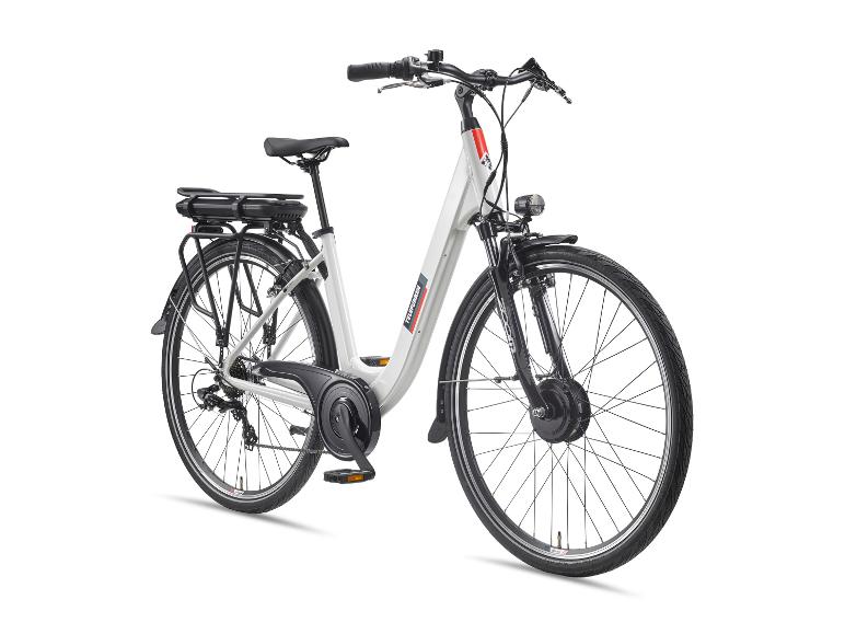 Weißes E-Bike mit schwarzem Sattel, Gepäckträger und Schutzblechen, von der Seite gesehen.