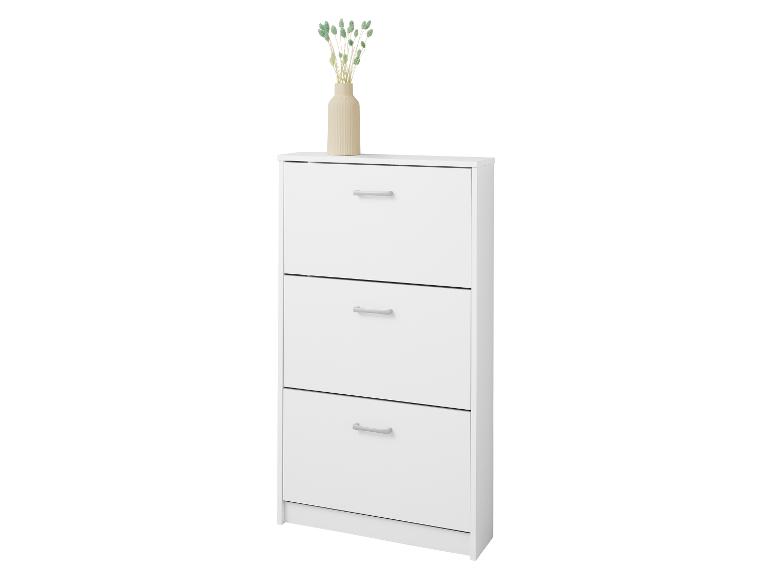 Weißer Schuhschrank mit drei Schubladen und einer Vase mit Trockenblumen darauf.