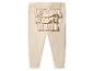 Hellbraune Baby-Leggings mit Rüschen am Po.