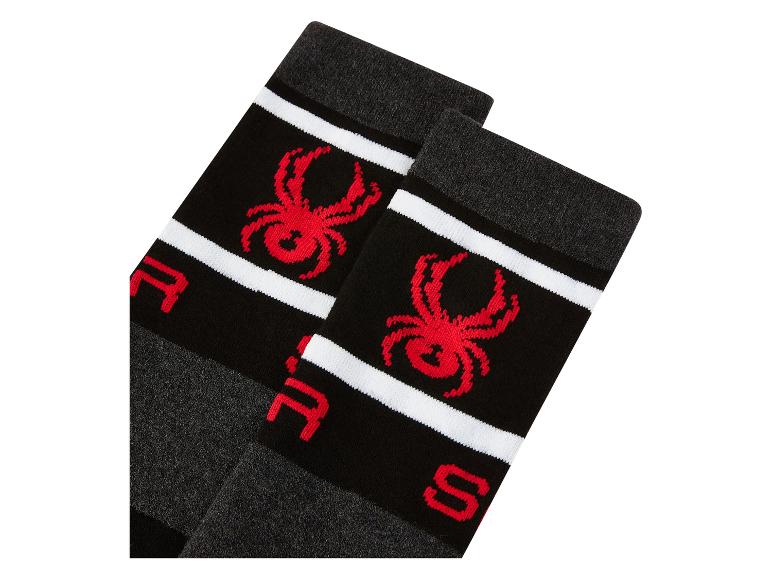 Ein Paar schwarze Socken mit roter Spinne und weißen Streifen