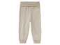 Beige Jogginghose mit elastischem Bund.